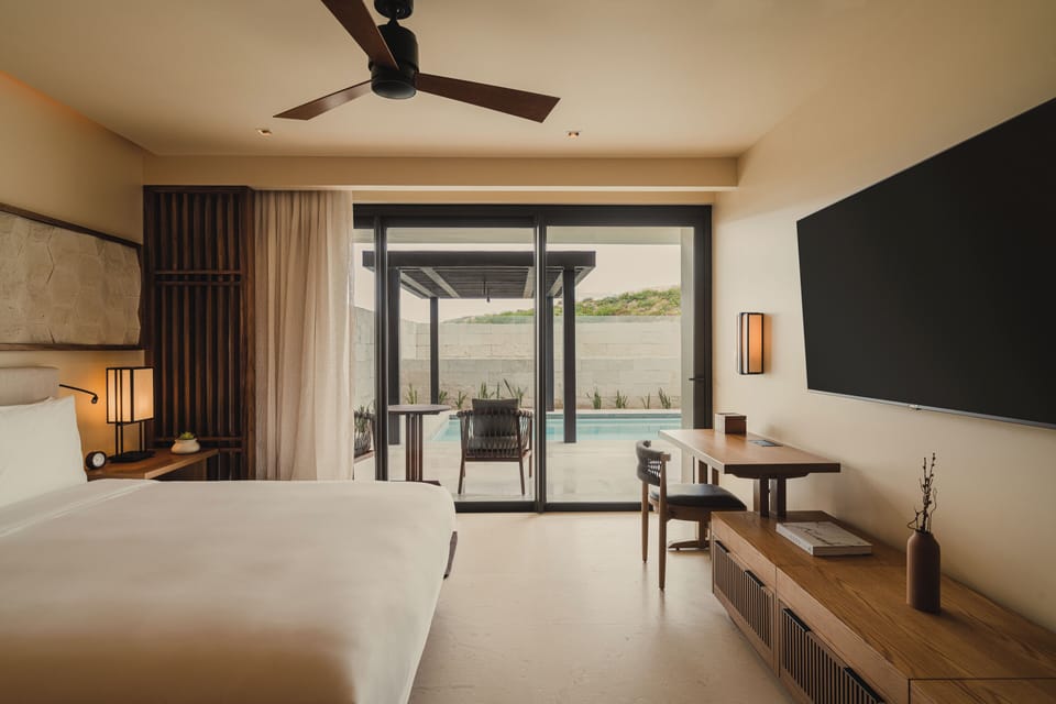 The master bedroom with King bed, huge bathroom, and sliding doors to your pool.
