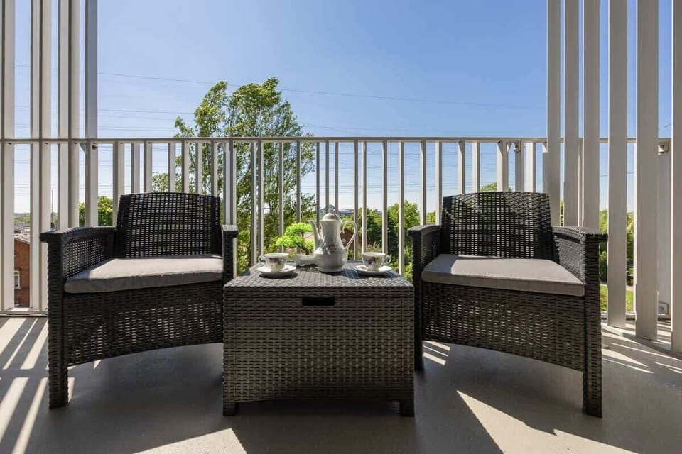 Comfortable outdoor seating to unwind on the balcony.

