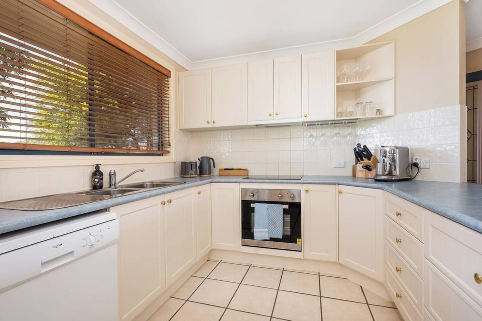The kitchen is fully-equipped with a fridge, oven, microwave, kettle, coffee machine, cooking utensils and a dishwasher for easy cleanup.
