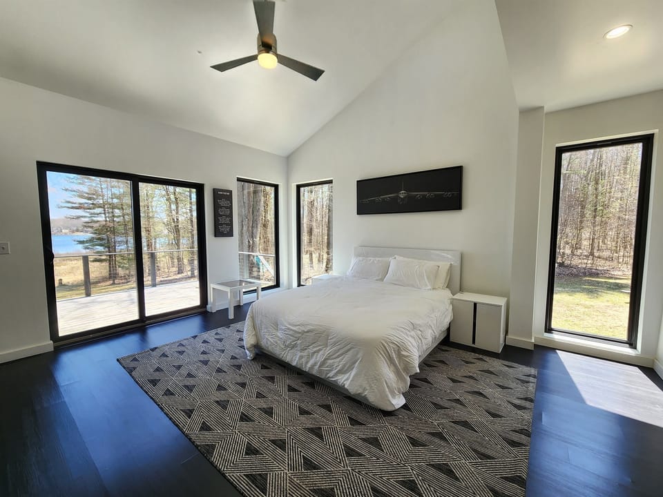 Master bedroom with queen size bed, attached ensuite bathroom