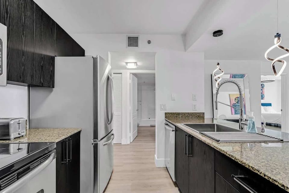 Fully stocked kitchen with complete set of cookware.