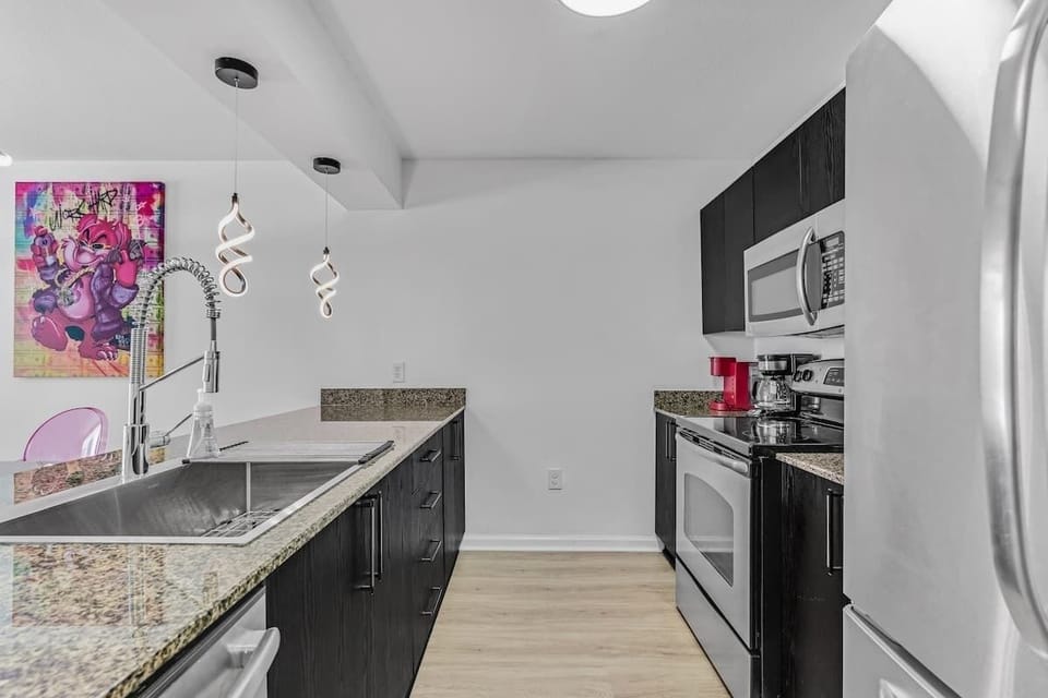 Fully stocked kitchen with complete set of cookware.