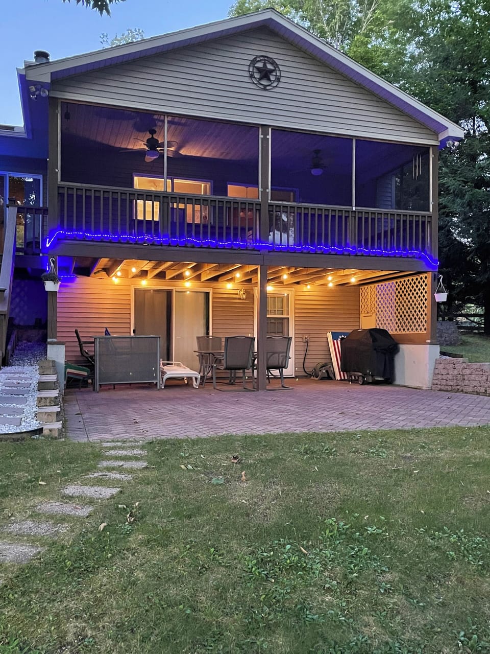 Night time view from the backyard with decorative lights.