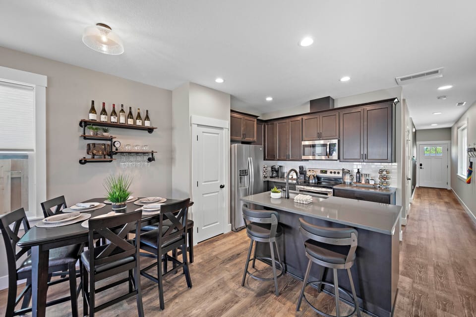 Dining Area | Open to Kitchen & Eating Bar | Fully Stocked Kitchen