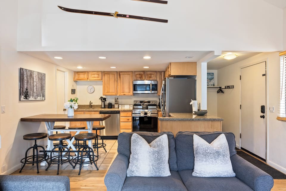 Open floor plan connecting the living room, kitchen, and dining area, ideal for gathering, entertaining, and spending time together.