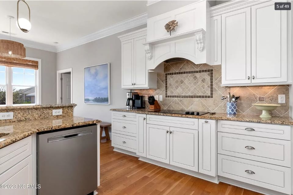 Plenty of dishes, silverware, glasses, and dishwasher with garbage disposal