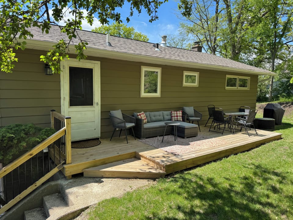 Private furnished outdoor deck facing wooded area