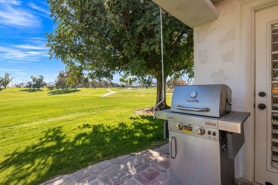 Spacious patio with BBQ, perfect for outdoor dining and sunset cocktails