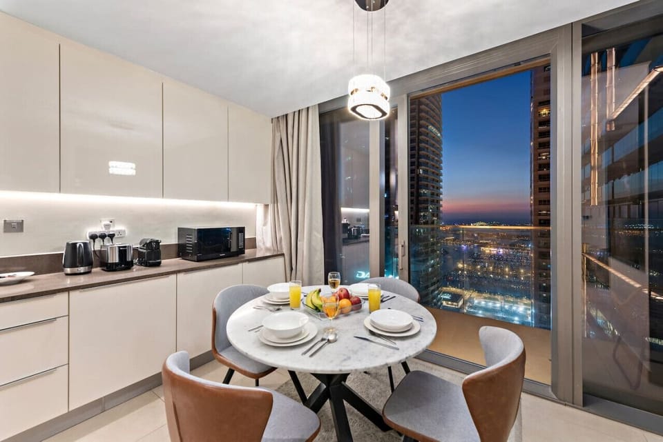 Dining Room: Enjoy breathtaking sunset views while savoring meals at this stylish marble table!