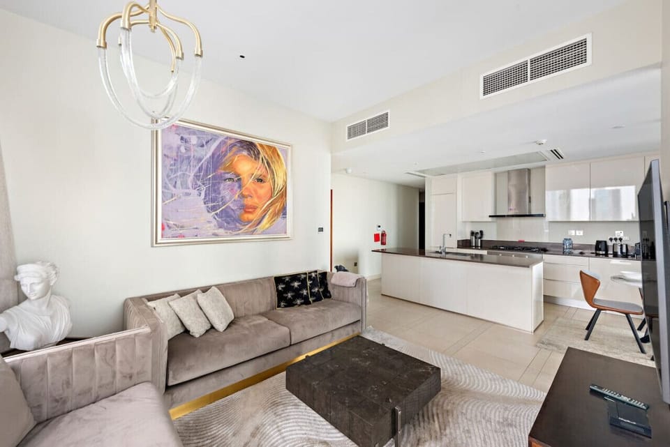 Living Room: Stylish and vibrant space with modern art, plush seating, and chic decor!