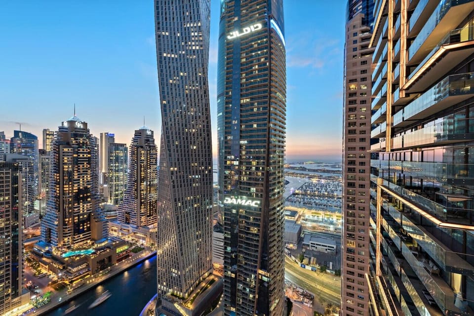 City View: Experience breathtaking skyline views from your private balcony at sunset!