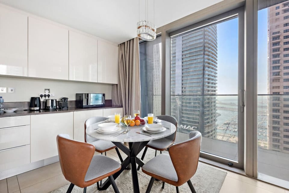 Dining Room: Savor meals with stunning skyline views from this chic, modern dining space!