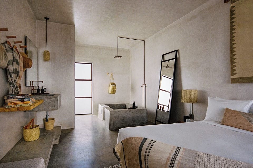Recharge in serene concrete chic with soft, natural textures.