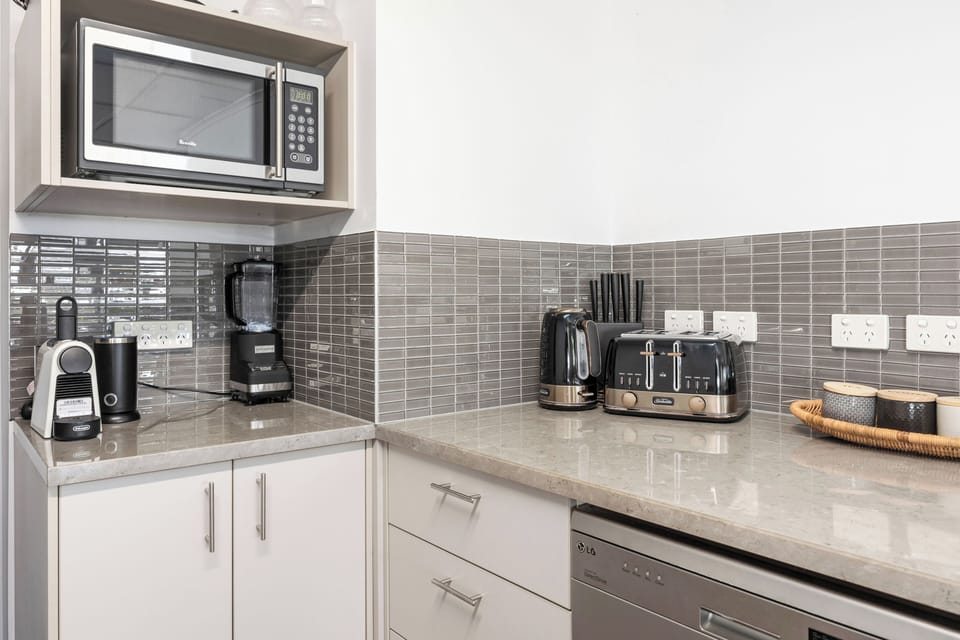 Kitchen kitted out with modern appliances including a Nespresso Coffee Machine.