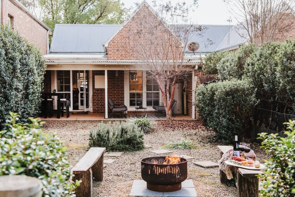 Experience cosy gatherings around the fire pit in the first cottage—Kareela, complemented by benches for shared moments under the stars.