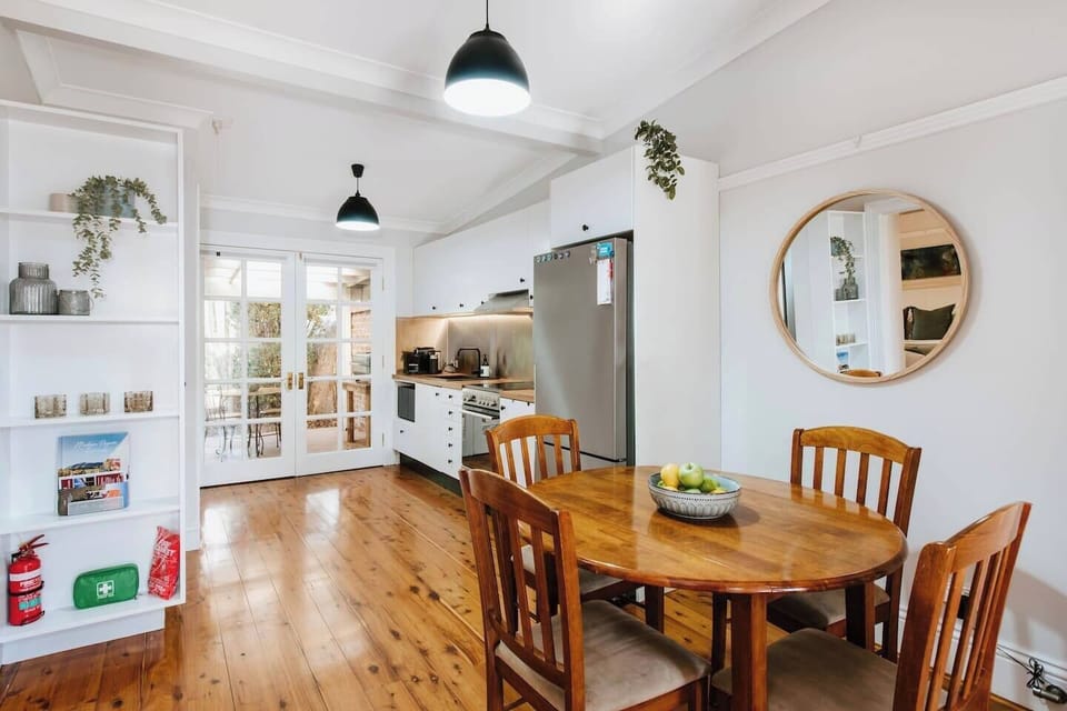 Adjacent to the kitchen, the dining area offers a cosy spot to enjoy your morning coffee or evening wine.