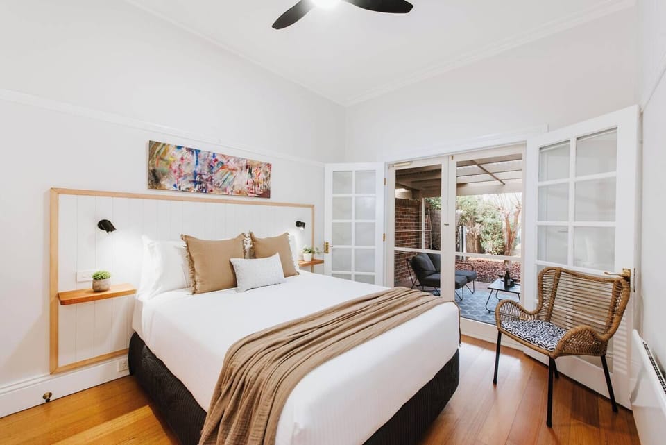 Retreat to the queen-sized bed in this cosy room, boasting direct access to the courtyard. 
