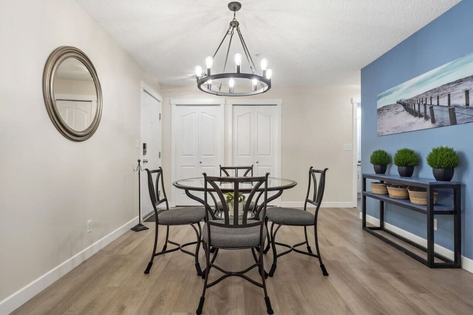 Dining area with seating for 6 at the table and 2 at the island.