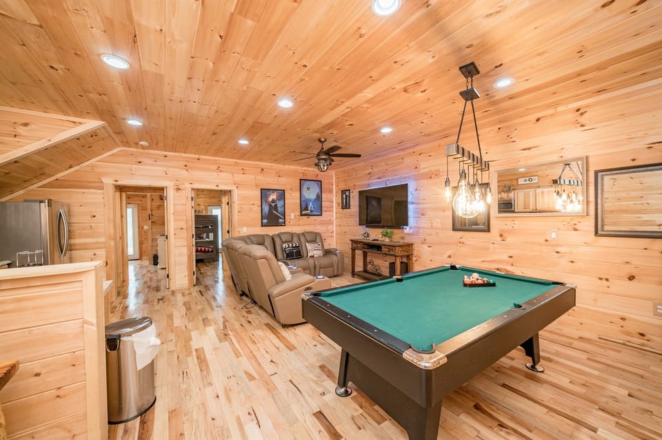 Pool table and living area in basement