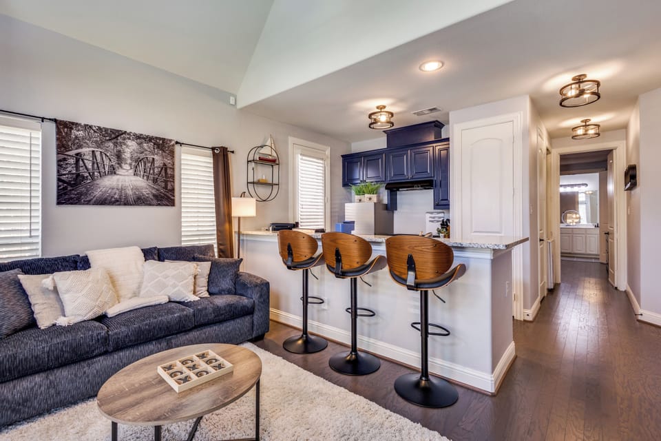 Kitchen island dining granite counter top with 3 adjustable bar stools.