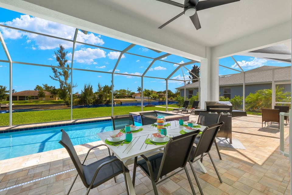 Enjoy your meals poolside with the dining area that seats 6