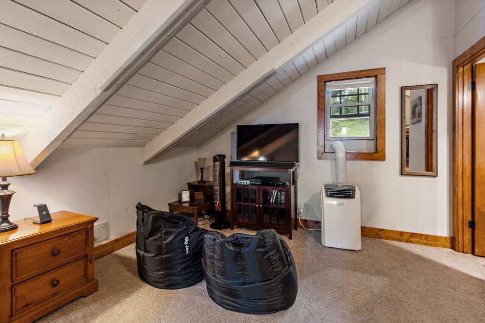 Kids love it, parents appreciate it—this fun bunk bedroom is perfect for young adventures and teens, complete with an Xbox and private bathroom.