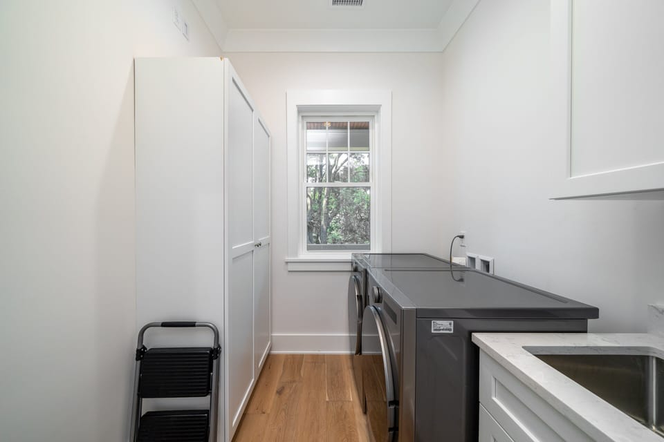 The laundry has a full-size washer and dryer