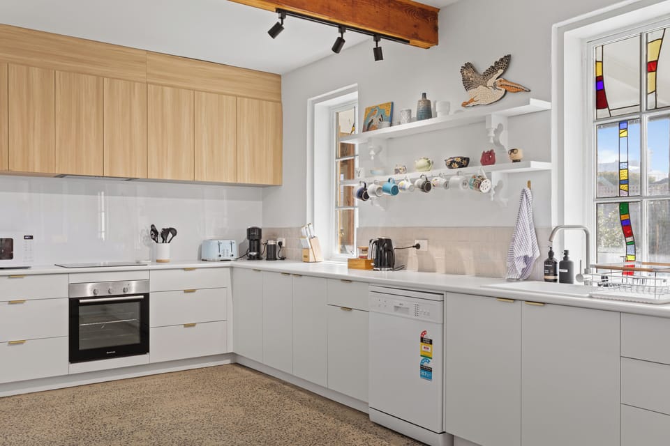 Cook with ease with a stove/oven, microwave, fridge/freezer, and the grocer just steps away