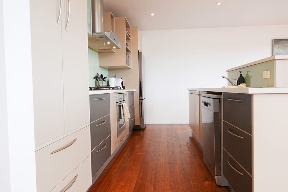 Galley kitchen with island and all the amenities