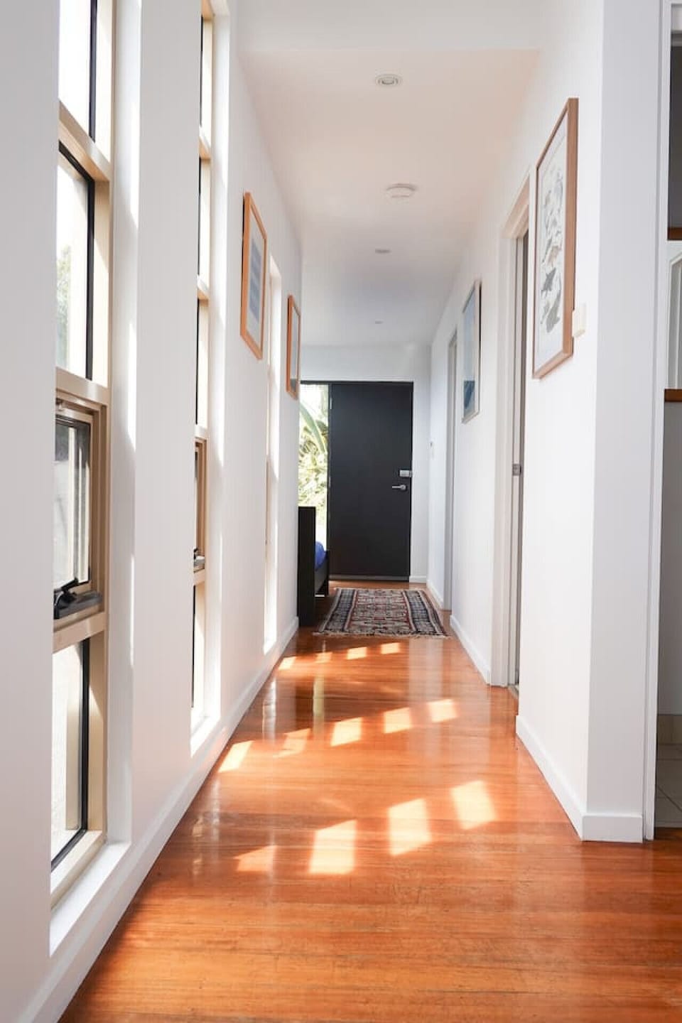 Main hallway to the 2 bedrooms and main bathroom, looking back to front door