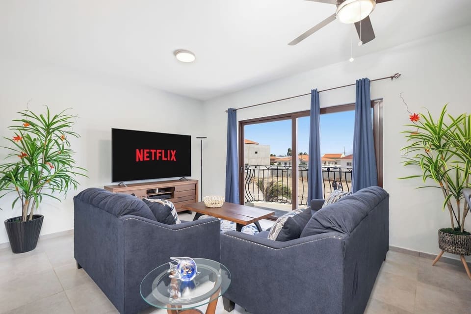 Sink into the plush embrace of a large sofa as you unwind in front of the sleek television, or step through the sliding door to the balcony and let the gentle breeze soothe your senses.