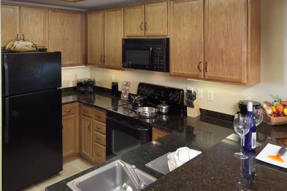 Fully-equipped kitchen with all the necessities to prepare a home cooked meal.