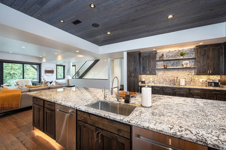The kitchen is equipped with high end appliances, including 2 dishwashers.