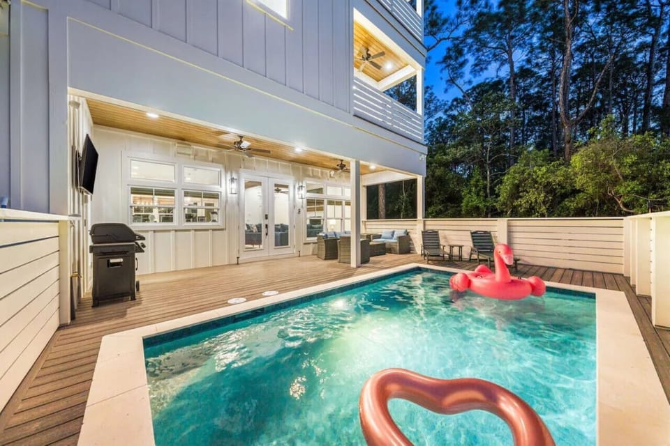 Dive into your private oasis with crystal-clear waters, covered deck seating, and BBQ ready for poolside dining adventures.