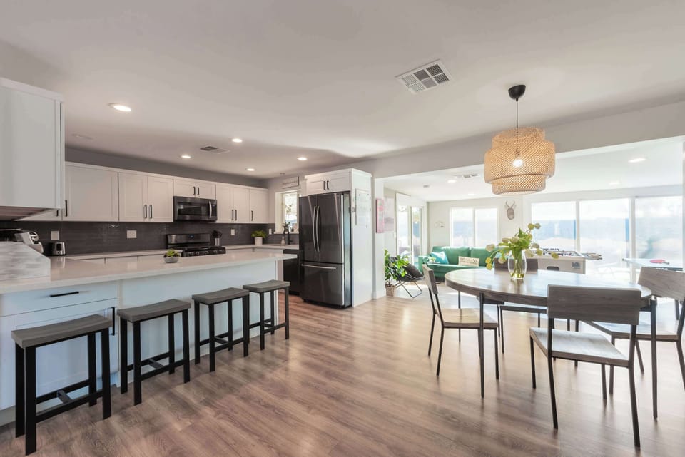 Spacious kitchen counters offer plenty of room to prep, serve, & gather.