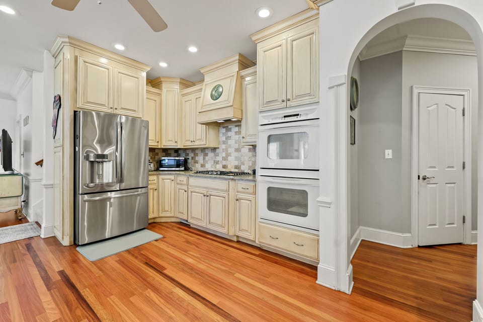 Granite countertops, double oven, 5-top cooktop, dishwasher and SS French door. 