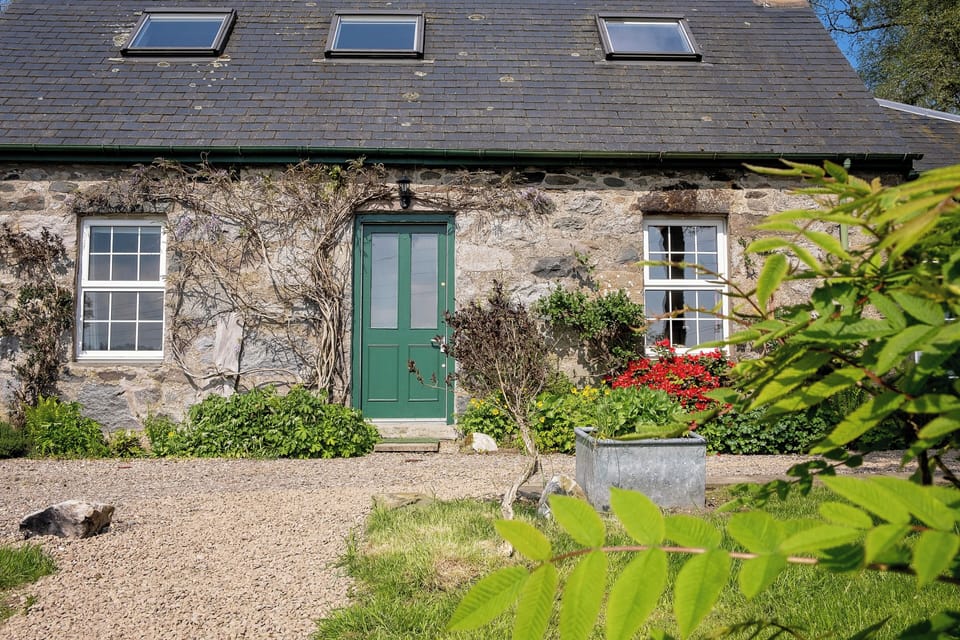 Front door of cottage leading to vestibule hallway