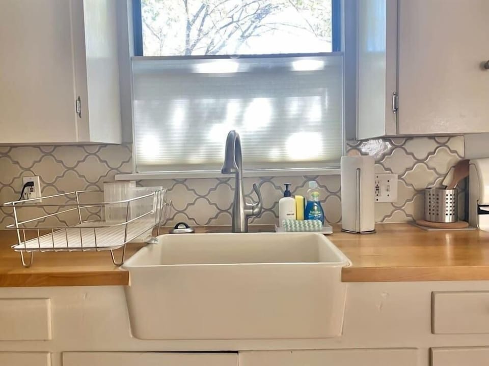 Kitchen equipped with cooking equipment, dishware, coffee, snacks, and if you are lucky...some local beer!