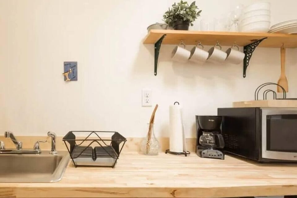 Kitchenette- drip coffee, fridge, and microwave.