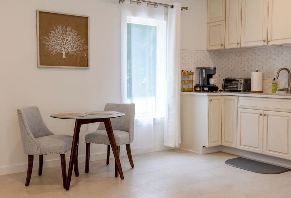 The dining area is convenient to the kitchenette