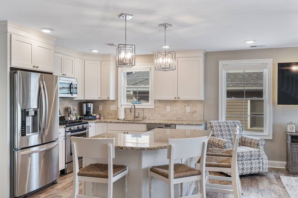Enjoy a beautiful kitchen paired with a cozy lounge chair by the window.