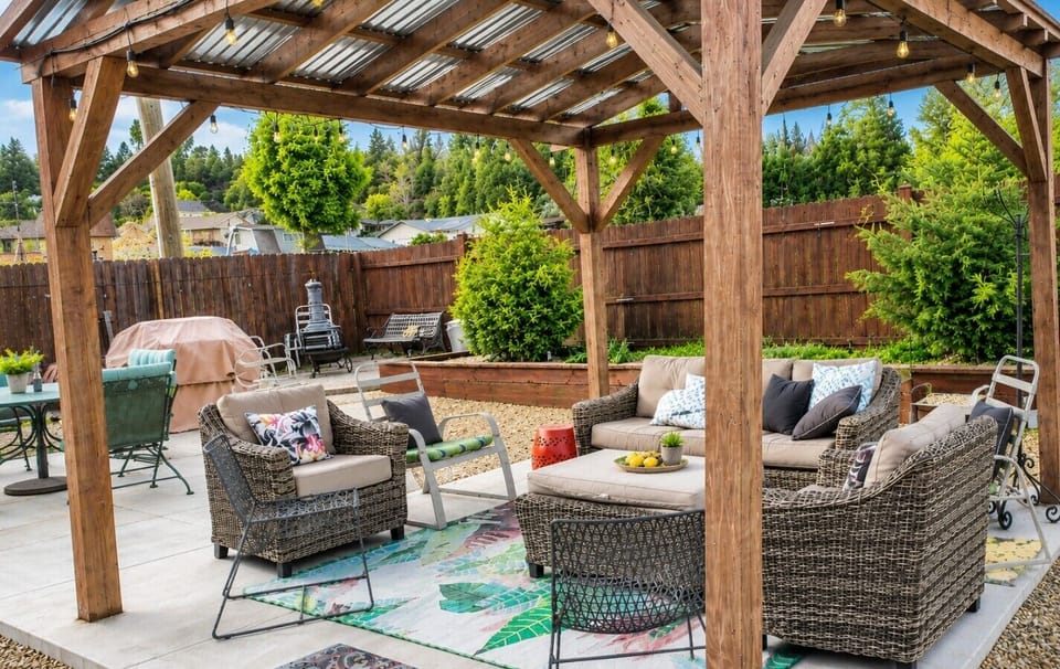 Gather under the covered pergola for outdoor dining, conversation, and relaxing evenings.