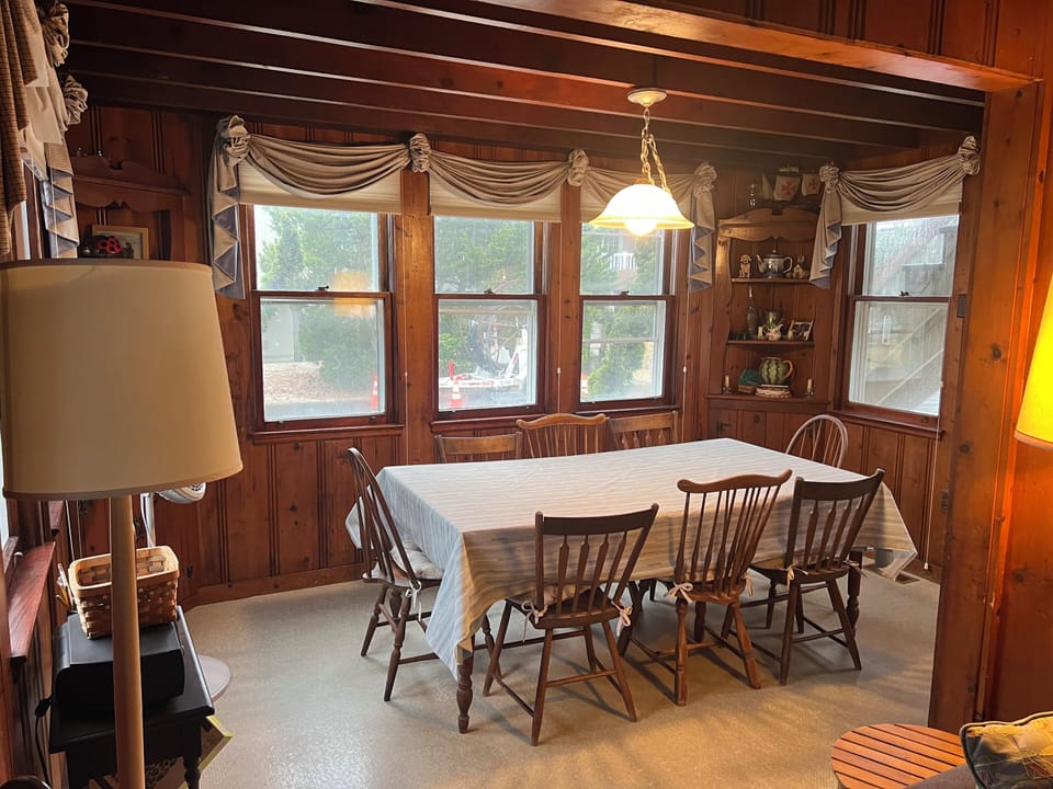 Dining room loaded with natural light seen from living room.