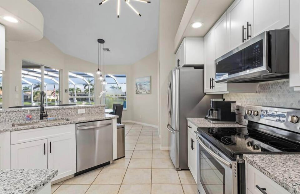 MODERN KITCHEN WITH NEW GRANITE AND STAINLESS APPLIANCES- KUERIG / DRIP COMBO