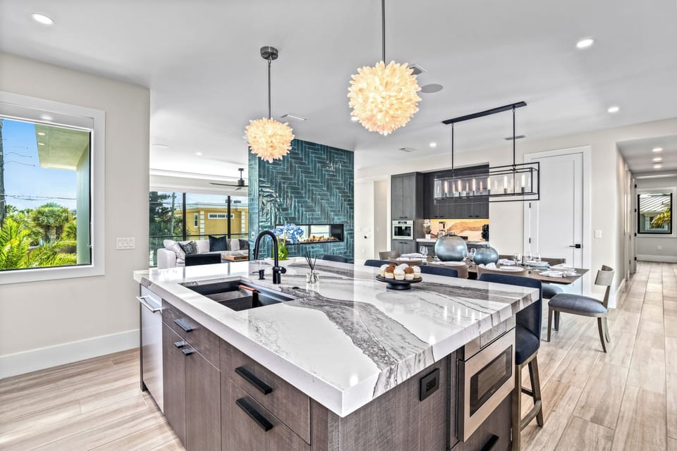 Gather around the spacious kitchen island where morning light floods the space, inspiring delicious meals and lively conversations.
