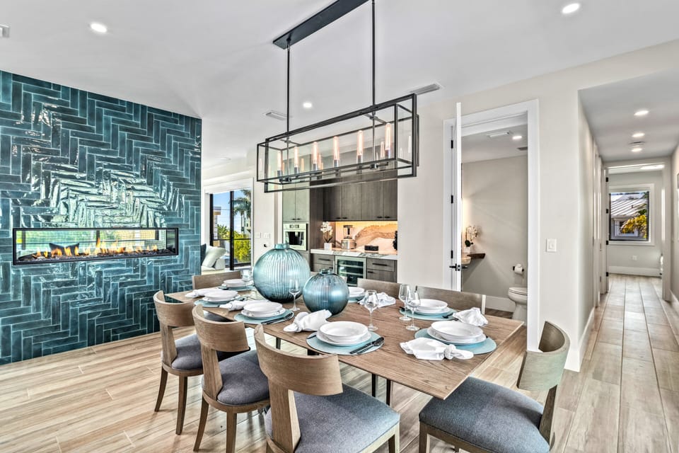 Gather around the dining table warmed by the glow of the fireplace, perfect for intimate meals and heartfelt conversations.