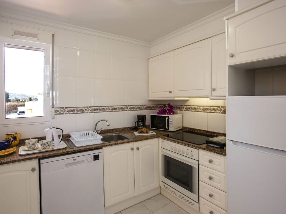 Cabinetry, Countertop, Property, Sink, Kitchen Sink, Kitchen Stove, Kitchen, Kitchen Appliance, Cooktop, Building