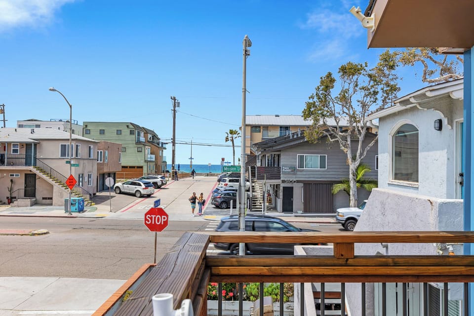 Sit back on the balcony and enjoy watching the surfers, waves, dolphins, the boardwalk, and the sunset. 
