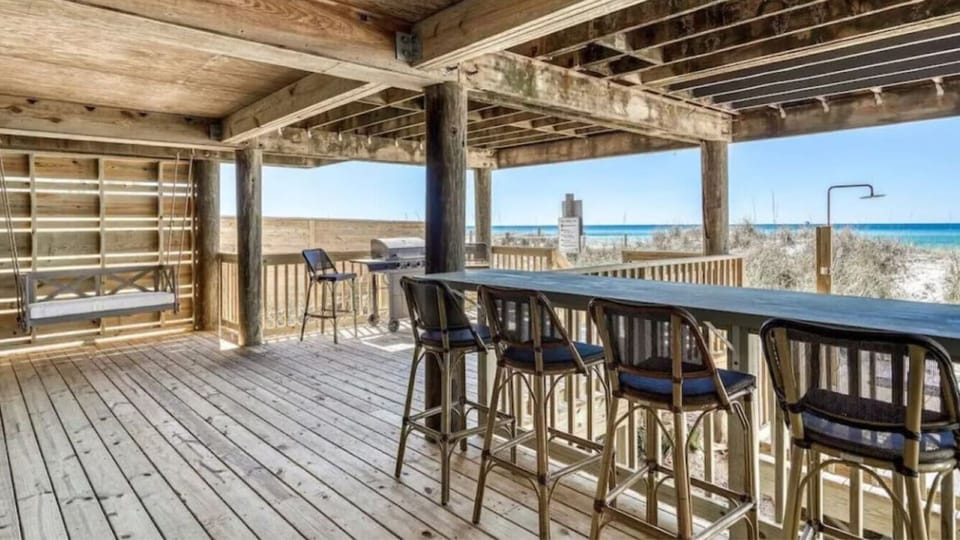 Enjoy beachside dining on your covered terrace with stunning ocean views and coastal breezes.