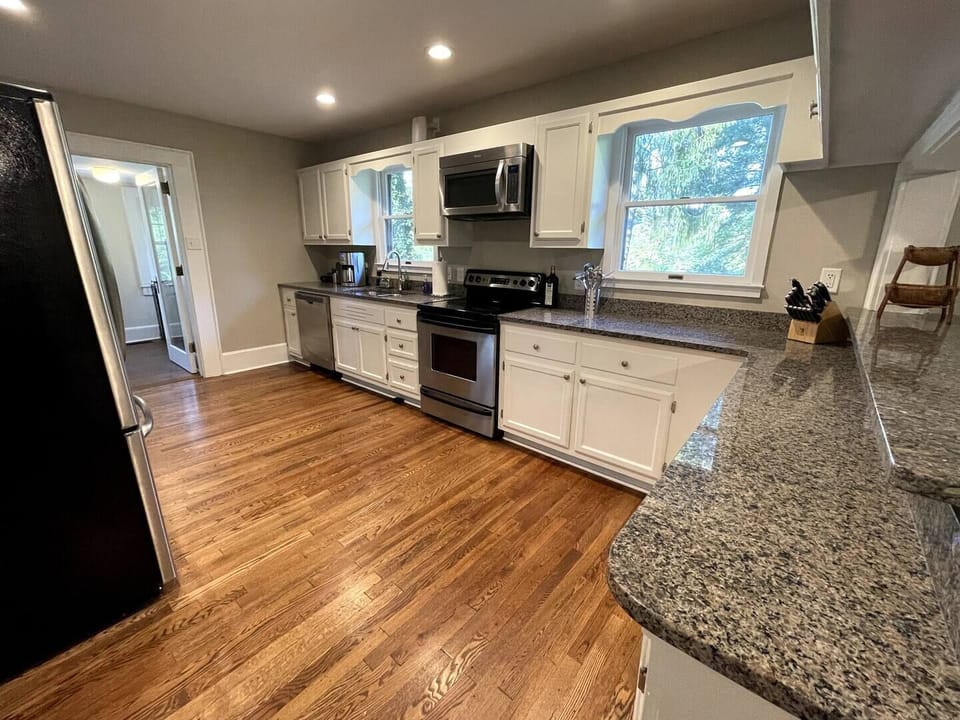 The kitchen is fully stocked!  Pots, pans, dishes, coffee maker, kettle, blender, toaster, wine glasses, and more.  Make sure you check the pantry for outside plates, cups, and wine glasses.